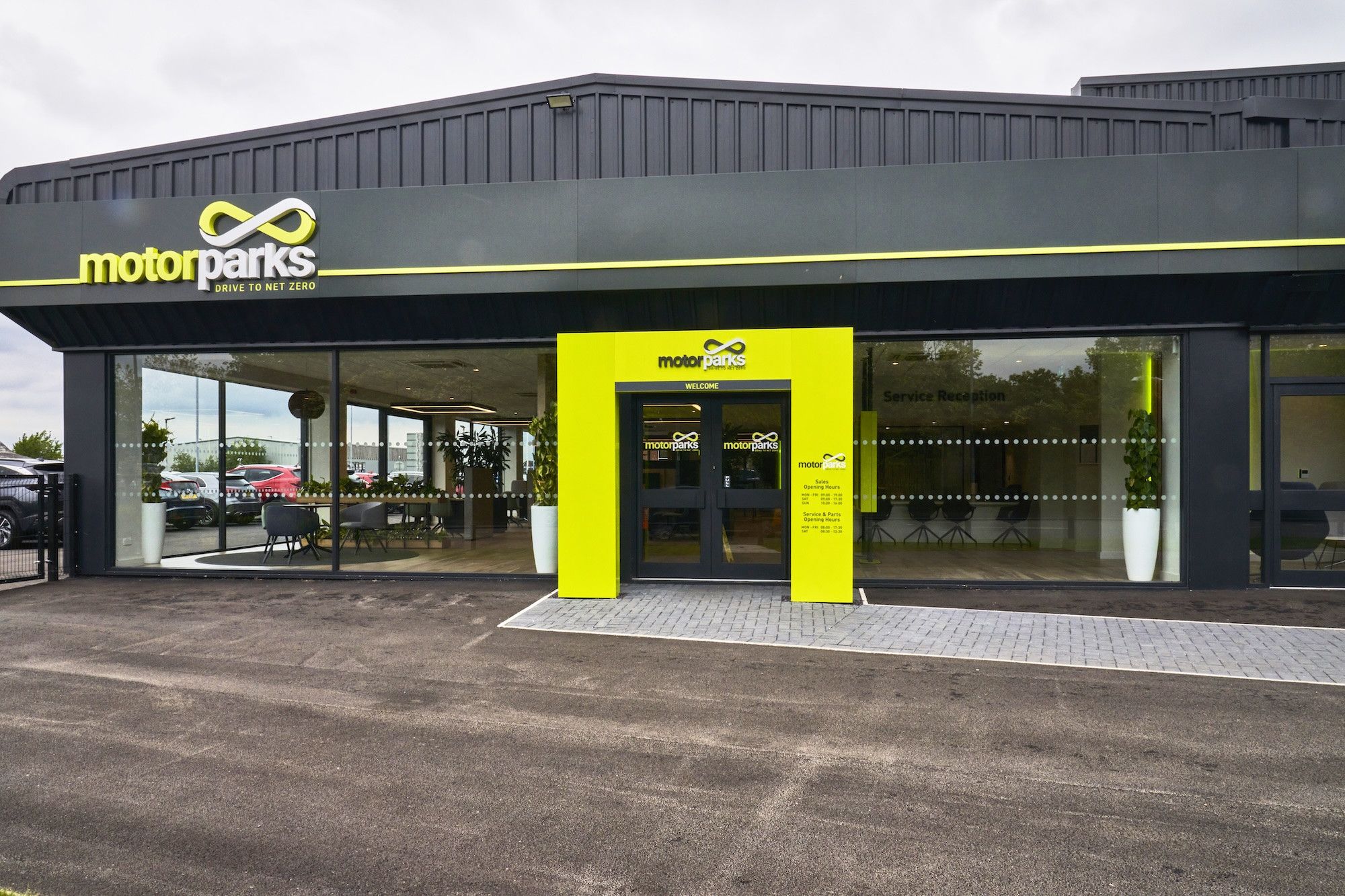 New corporate signage and a value engineering exercise for a sustainable car dealership.